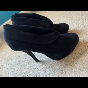 High heeled black booties